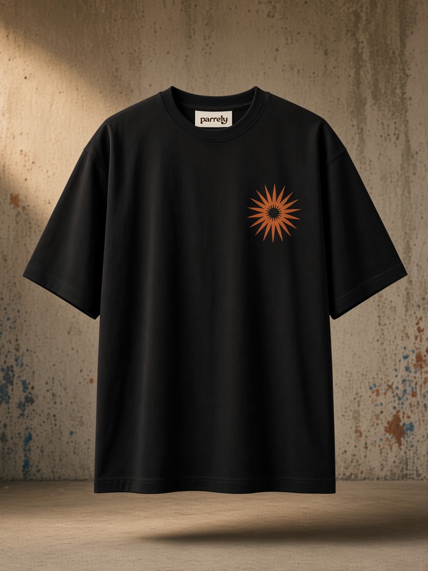 Black Heavyweight Tee with a small orange sunburst printed on the left chest